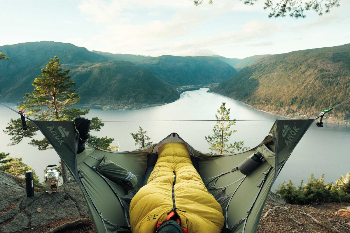 Draumr hammock hanging between two trees with a view